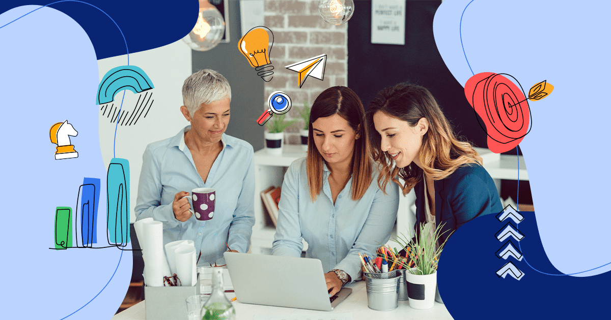 a team of women surrounding a computer