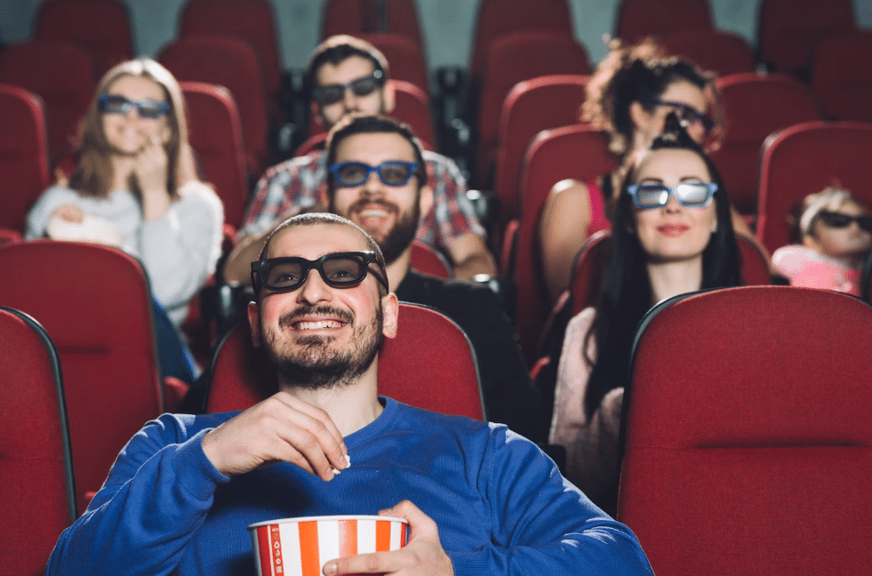 Navigating Movie Marketing Challenges Amidst Actors' Strikes - people watching a movie (illustrative image)
